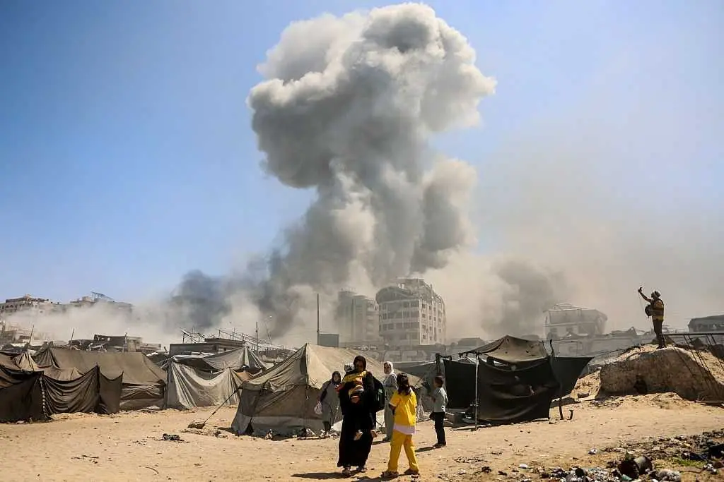 Barrage of Israeli airstrikes kills 32 in Gaza City, including 12 children, hospital says