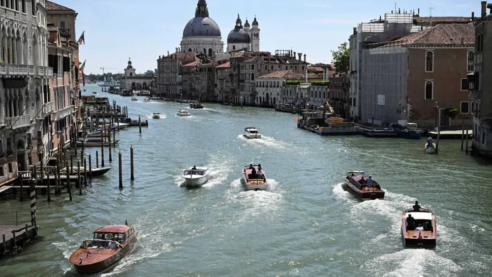 Tourists fined and banned from Venice for swimming in canal