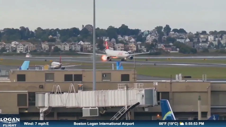 Flames shoot out of Swiss Airlines plane while on runway at Massachusetts airport