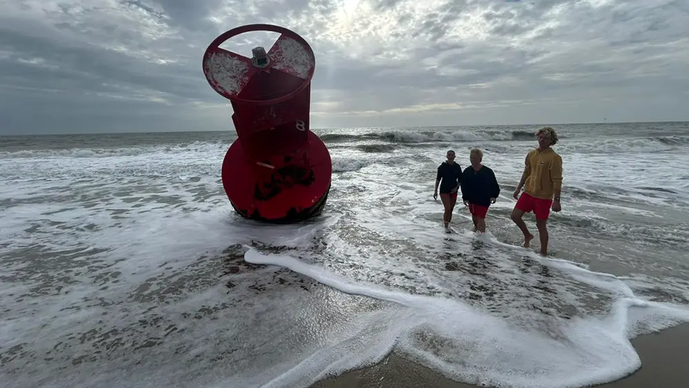 Massive buoy washes ashore on Tybee Island, prompting safety warnings for beachgoers