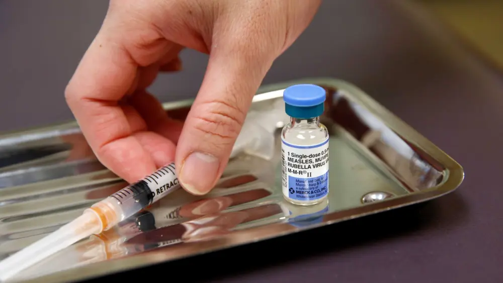 Acting CDC director, citing Trump directive, calls for MMR shot to be split into three