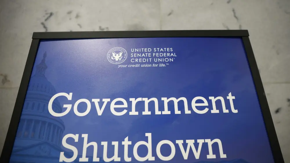 Judge temporarily blocks Trump administration from firing workers during shutdown