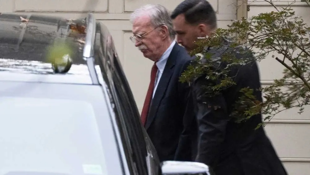 Bolton arrives at court to surrender to authorities on charges in classified information case