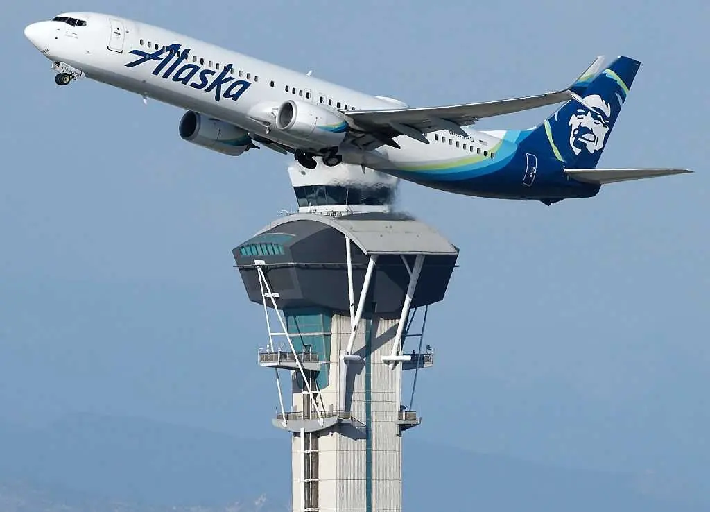 Alaska Airlines says an information technology outage is grounding its flights