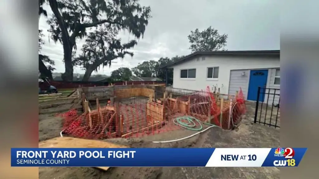 Front yard pool permitted by mistake has neighbors of 20 years in a feud