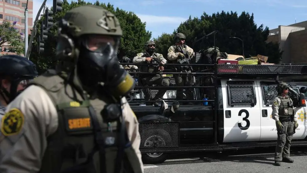 Trump administration sues California over law banning masked federal agents