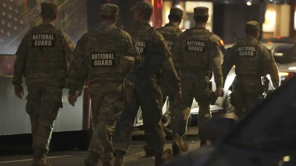 Suspect in shooting of National Guard members faces murder charge as US halts all asylum decisions