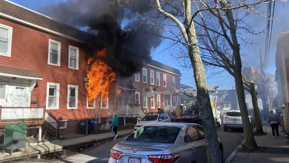 Utility worker credited with rescuing resident from burning row home