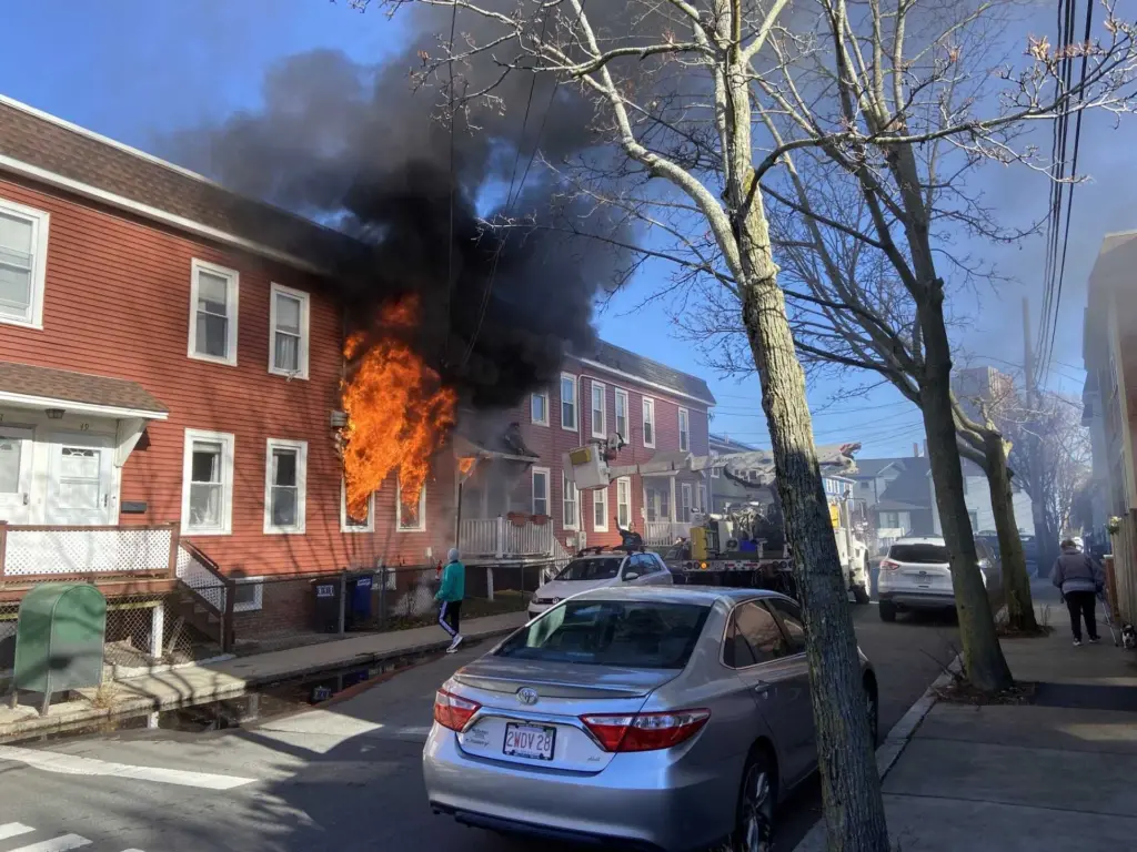 Utility worker credited with rescuing resident from burning row home