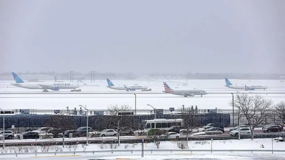 Thousands of US flights have been delayed as winter weather moves across the country
