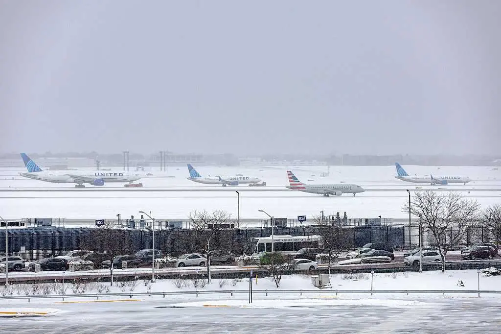 Thousands of US flights have been delayed as winter weather moves across the country