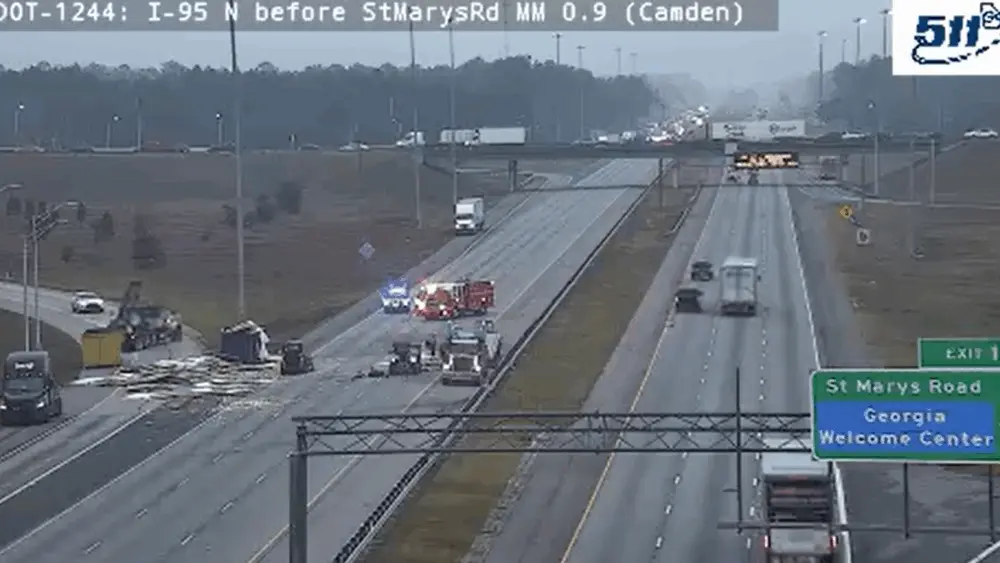 Overturned tractor-trailer shuts down lanes on I-95