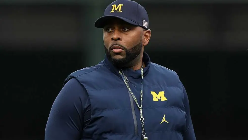 Fired Michigan football coach Sherrone Moore charged with home invasion, stalking