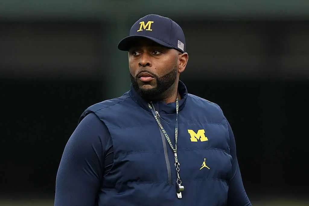Fired Michigan football coach Sherrone Moore charged with home invasion, stalking