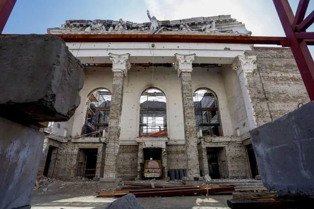 Russia opens rebuilt theater in occupied city years after its airstrikes killed hundreds there