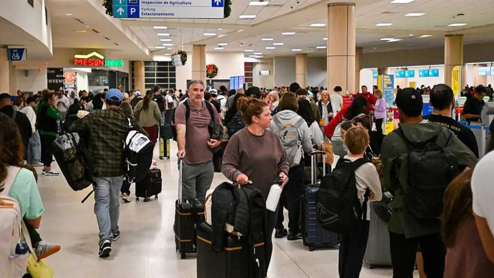 Travelers stranded in Caribbean as US military operation sends airlines scrambling to add flights