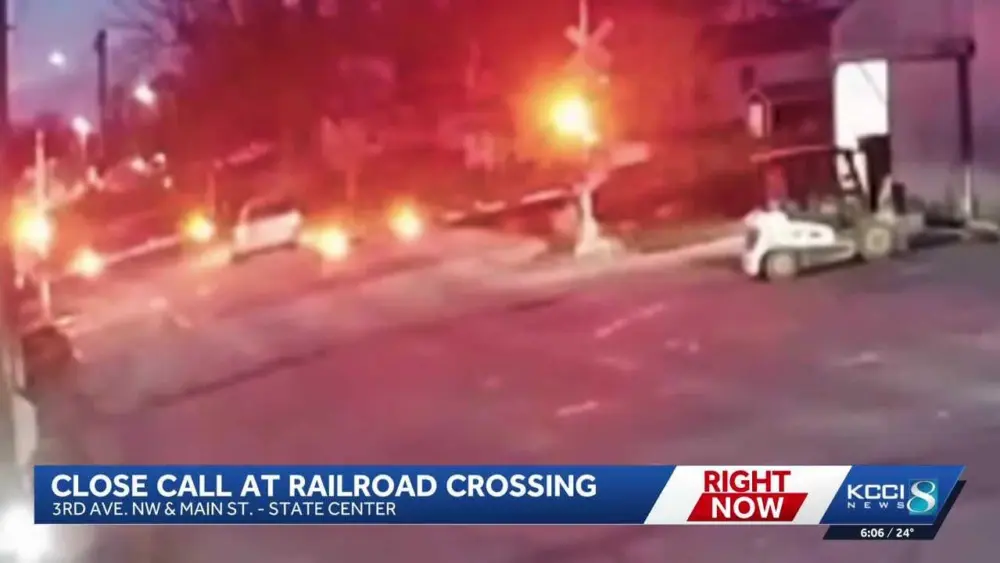 Van drives through active railroad crossing, narrowly misses train