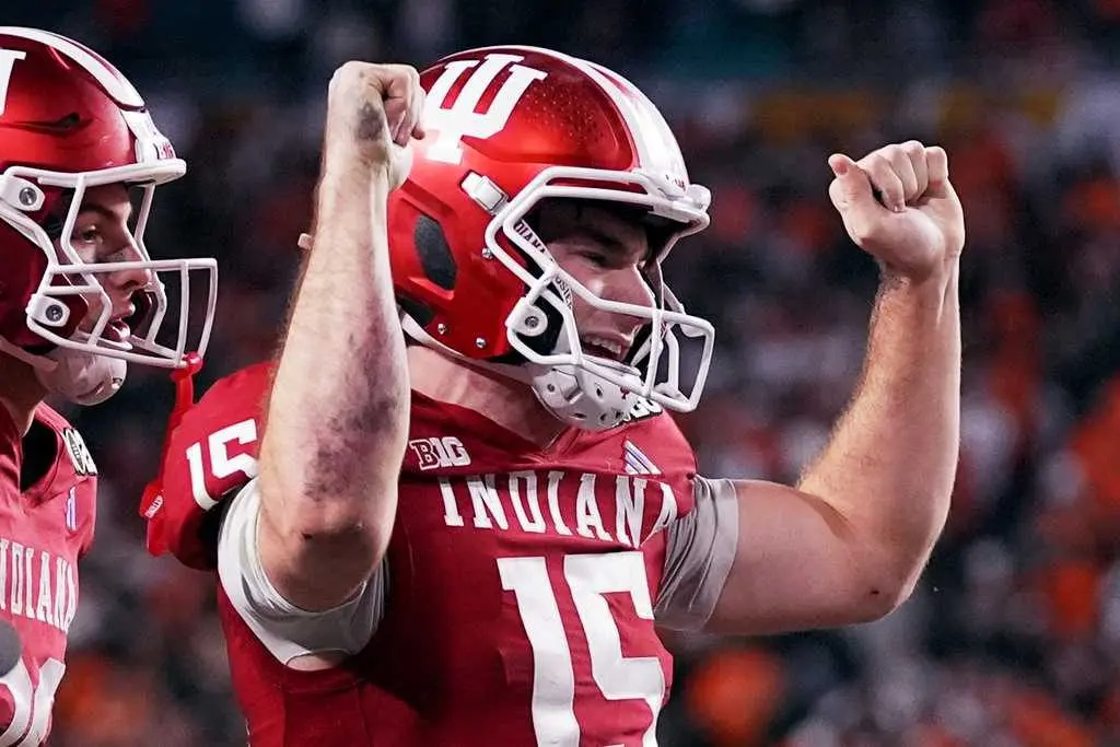 Indiana completes undefeated season and wins first national title, beating Miami in CFP final