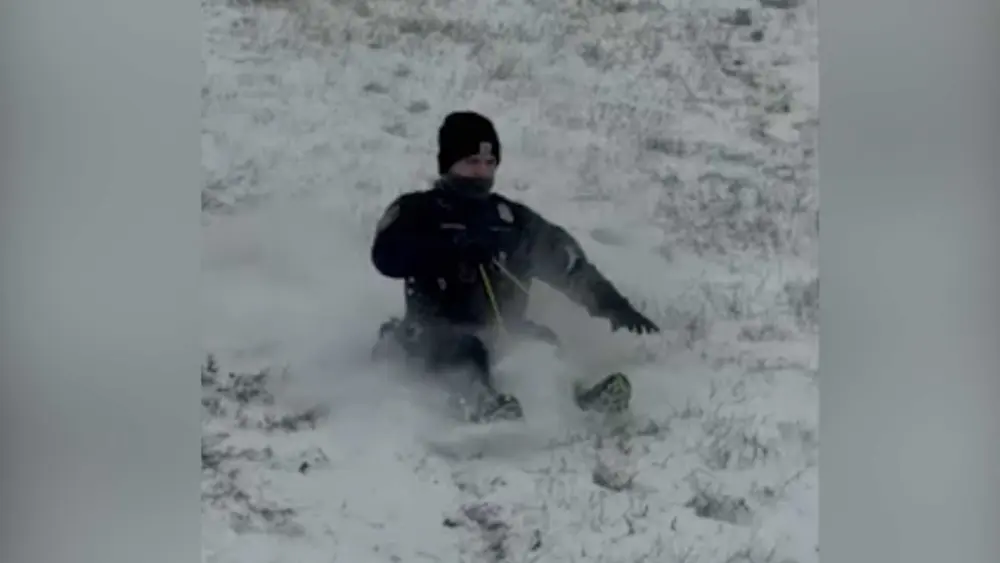 Police officers grab sleds and join Oklahoma children for snow day fun