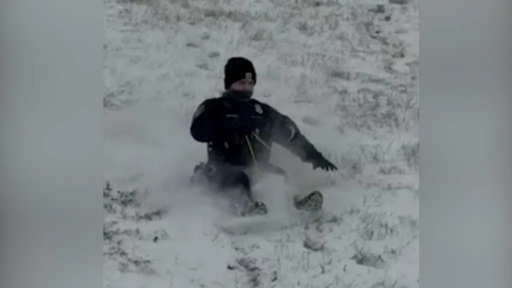 Police officers grab sleds and join Oklahoma children for snow day fun