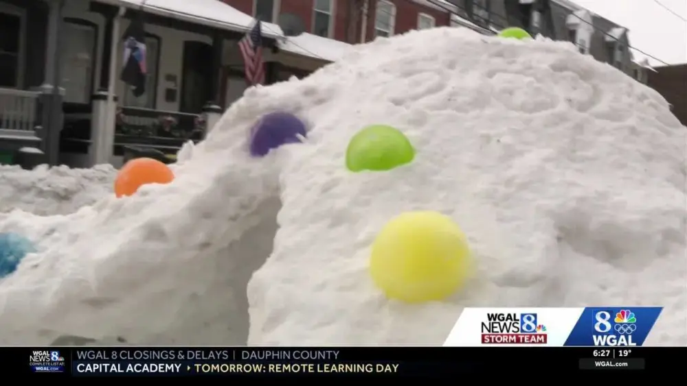 Pennsylvania family builds colorful snow fort from snowplow piles