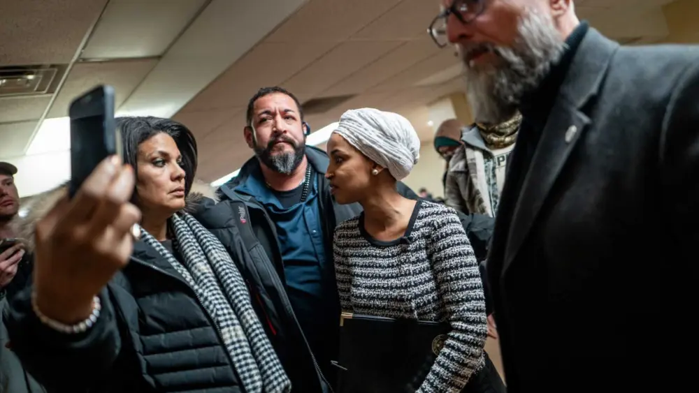 Man sprays unknown substance on Rep. Ilhan Omar and is tackled at Minneapolis town hall