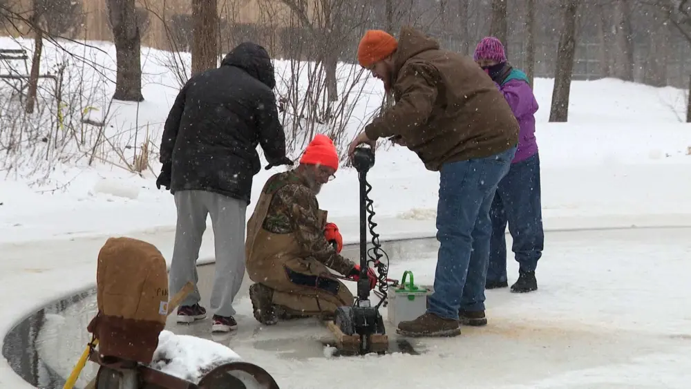 Kentucky men create carousel on frozen pond using chainsaws, motor