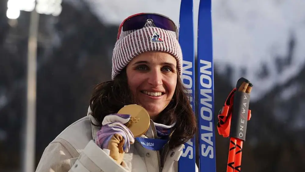 Why is there controversy surrounding French biathlete Julia Simon's individual gold medal win?