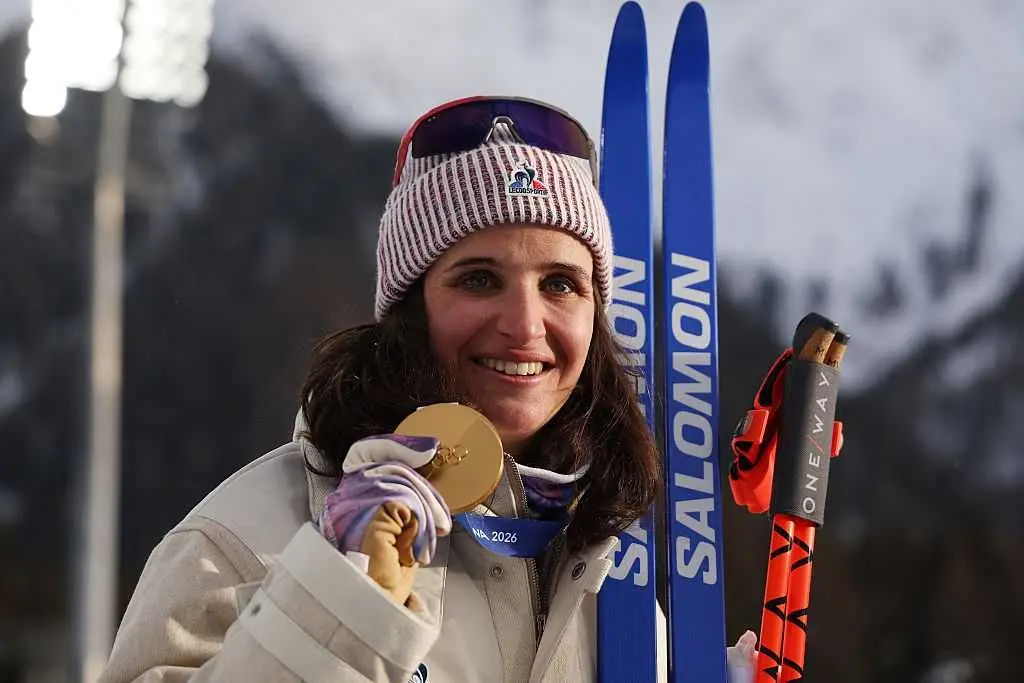 Why is there controversy surrounding French biathlete Julia Simon's individual gold medal win?