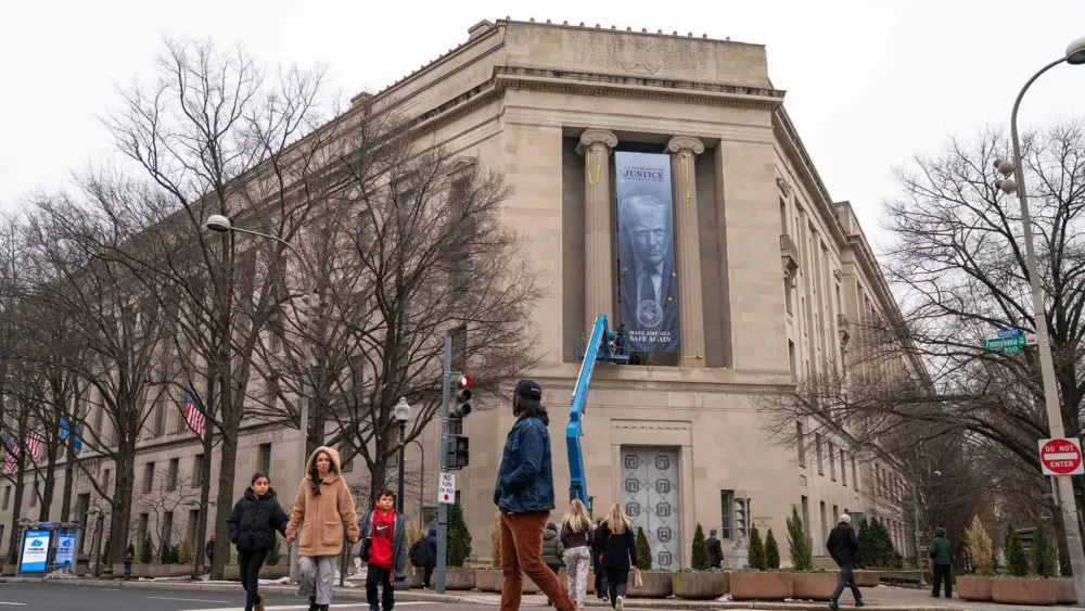 Giant banner of Donald Trump hung at Justice Department headquarters