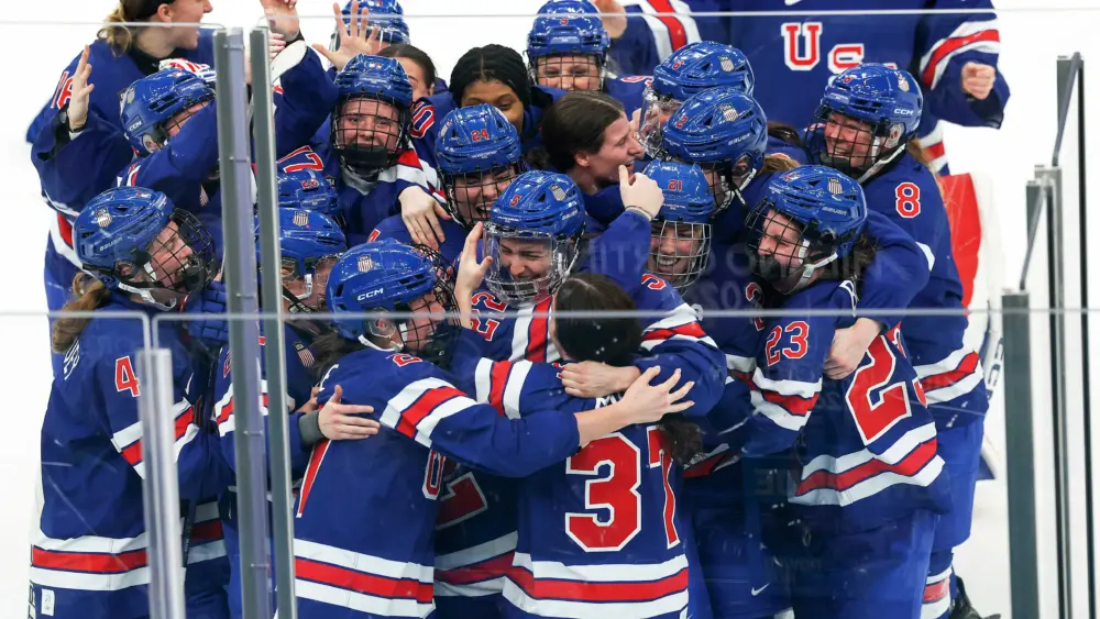 US wins its third Olympic gold medal in women's hockey, beating Canada in overtime