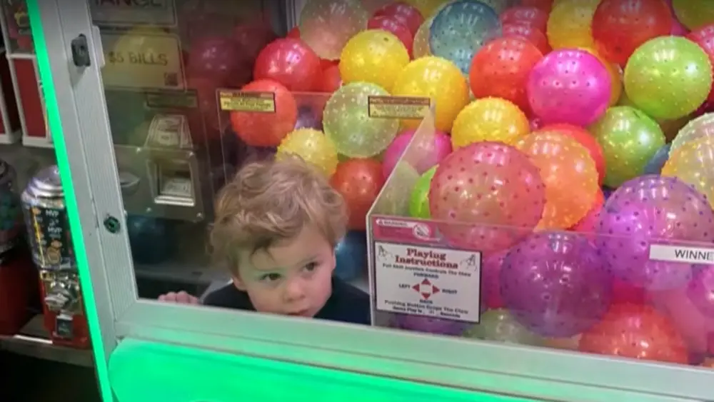 Toddler rescued after climbing into claw machine in Missouri