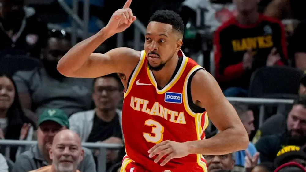 McCollum scores 30, Johnson has a triple-double as the Hawks beat the Bucks for 9th straight win