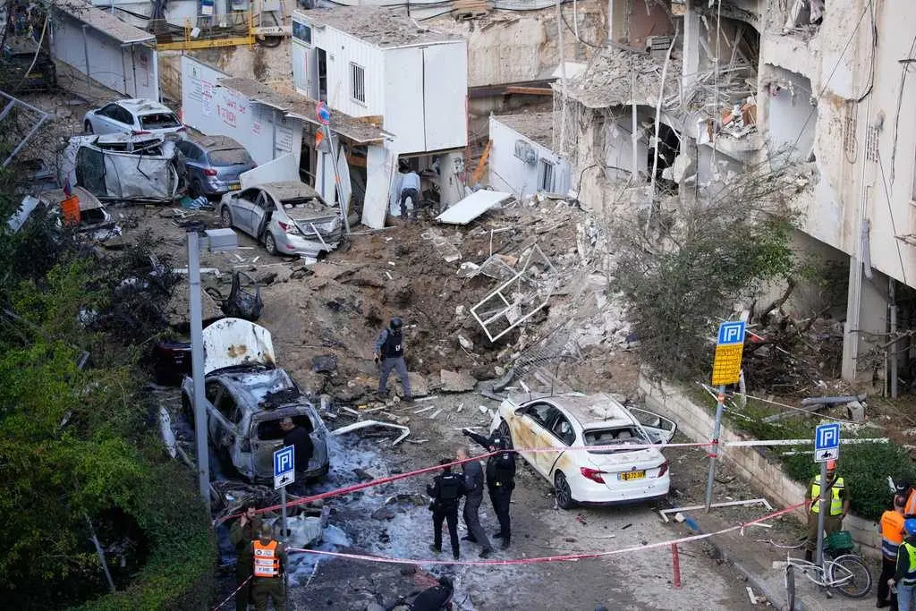 Iran targets Israel and Gulf Arab states even as Trump says US is in talks to end the war