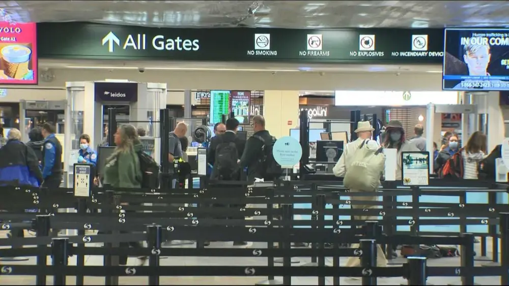 Airport bottlenecks ease as TSA workers get paid, but shutdown continues