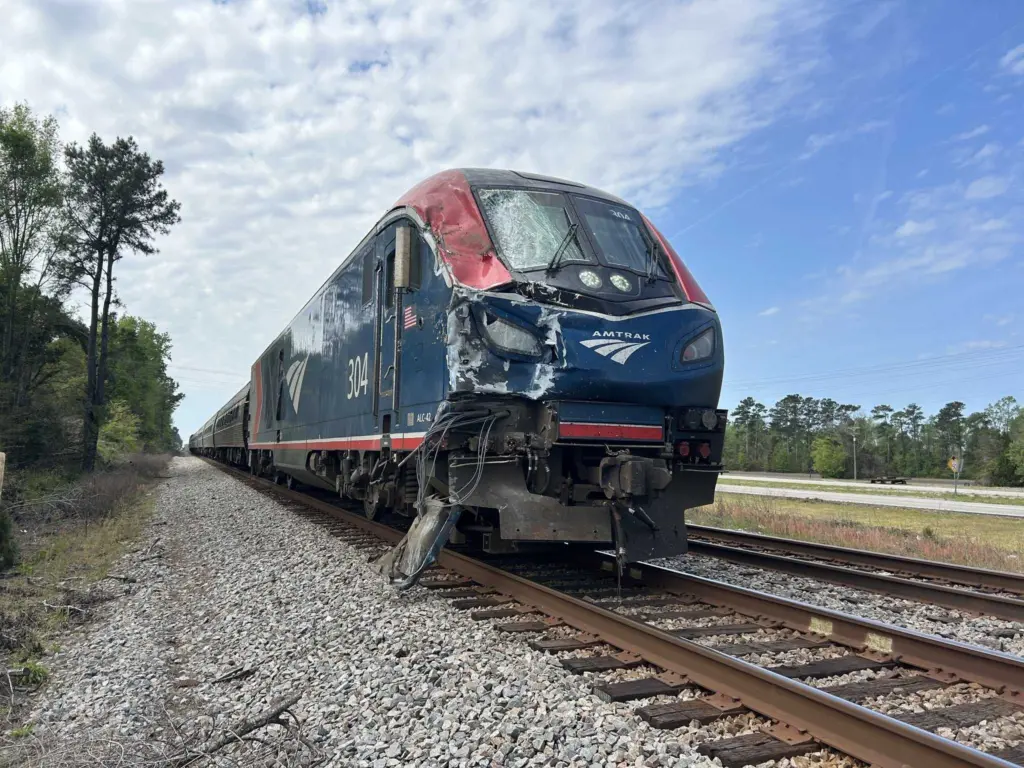 Amtrak train, with 100 people onboard, collides with garbage truck in South Carolina