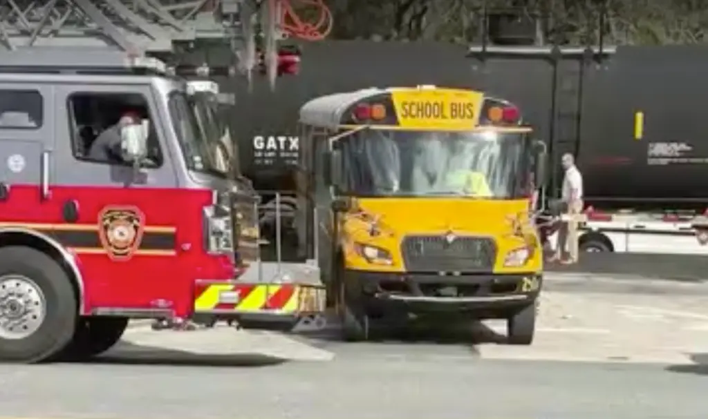 Florida school bus driver faces 29 counts of child neglect after close call with train