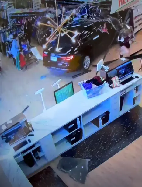 Wild video shows car narrowly missing shopper after ramming through store