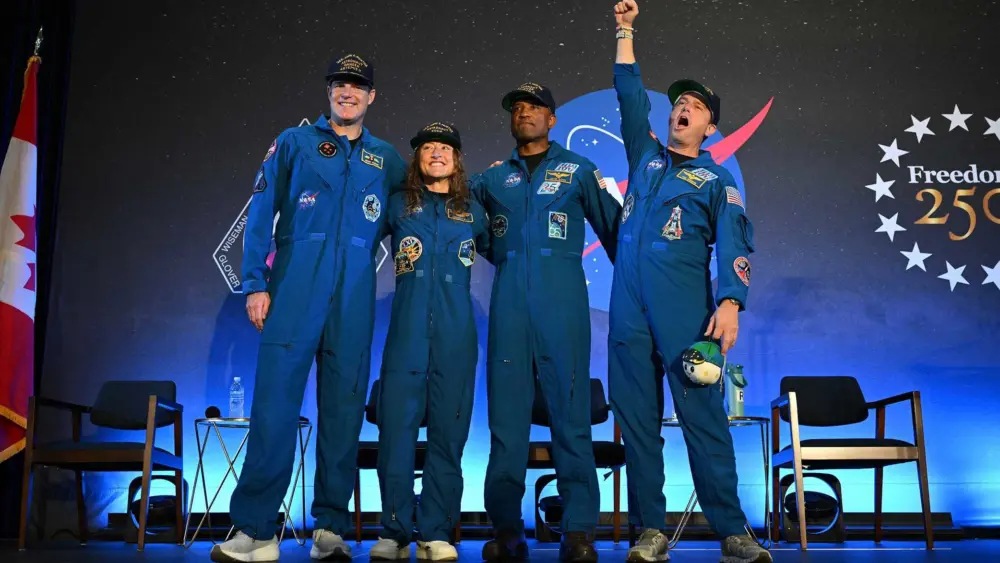 Artemis II astronauts answering questions about moon flyby mission