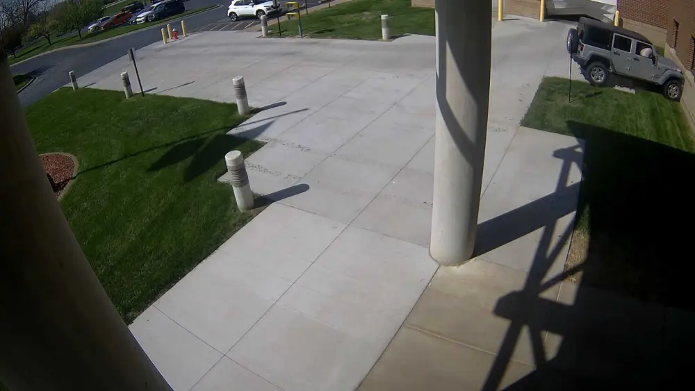 Surveillance video shows man crashing into Iowa county jail twice