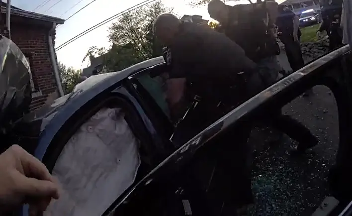 Bodycam video shows officers rescuing 2-month-old after police pursuit, crash