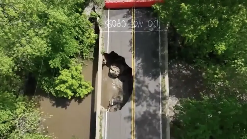 Family drives into massive hole in 96-year-old Kansas bridge