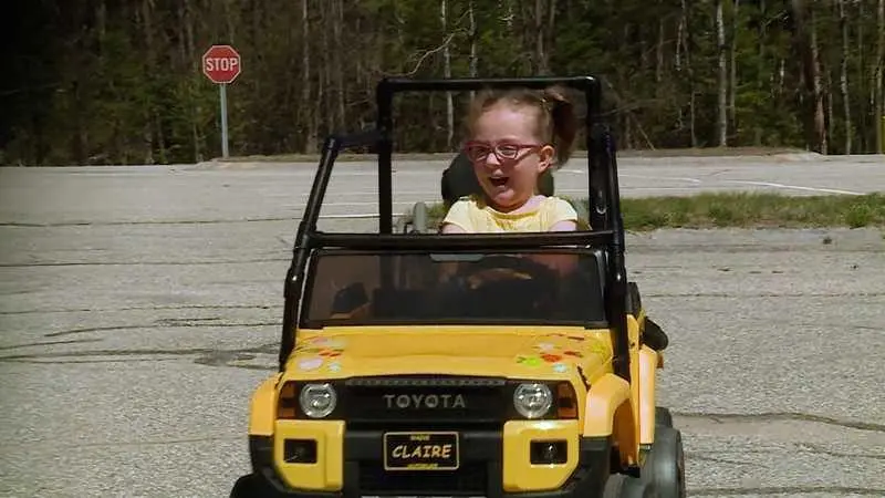College students gift adaptive toy car to girl with spina bifida