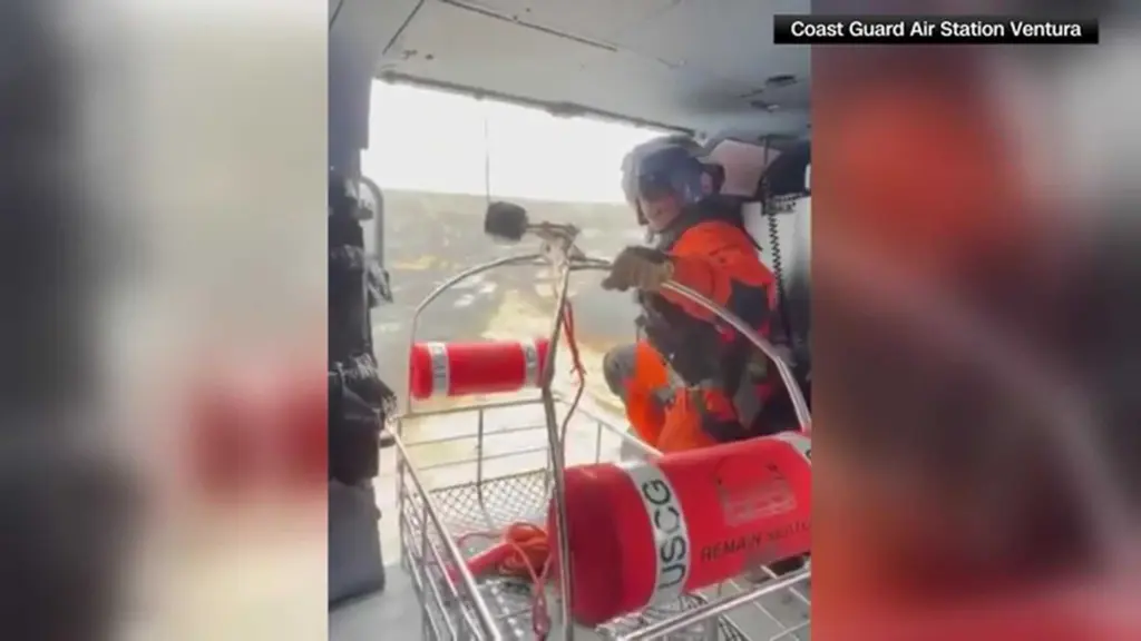 Video shows Coast Guard rescuing stranded boater stranded on an island amid wildfire