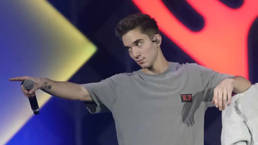 Ex-girlfriend of boy band member charged with trying to hire a hitman to kill him