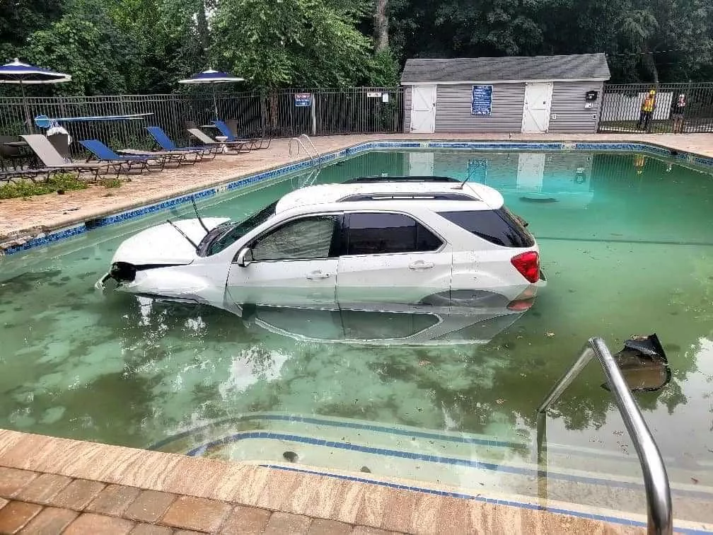 car-into-pool-66a52626a3398492300