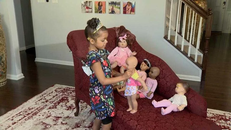 ailani-myers-shows-off-her-dolls-jpg-66a945bc0cf2f293655