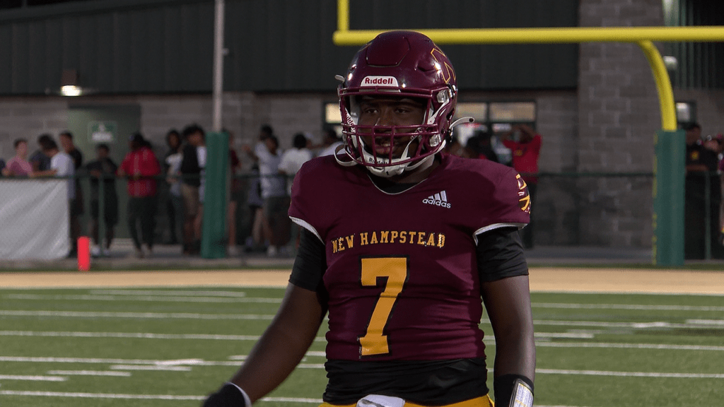 new-hampstead-quarterback-rashawn-truell-warms-up-ahead-of-the-second-half-against-effingham-south-66bebebd5ec6c662720