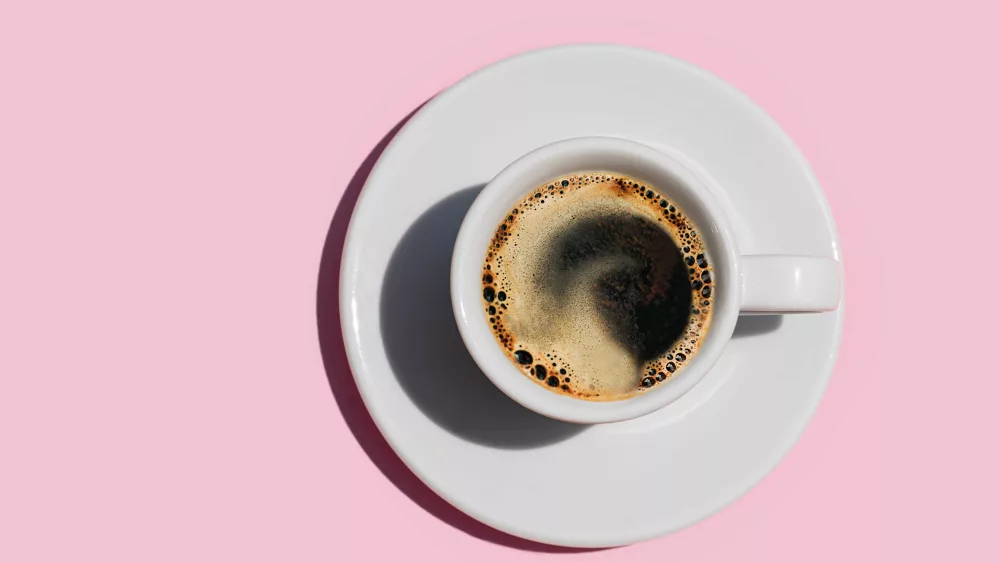 directly-above-shot-of-coffee-on-pink-color-royalty-free-image-1725899361151821