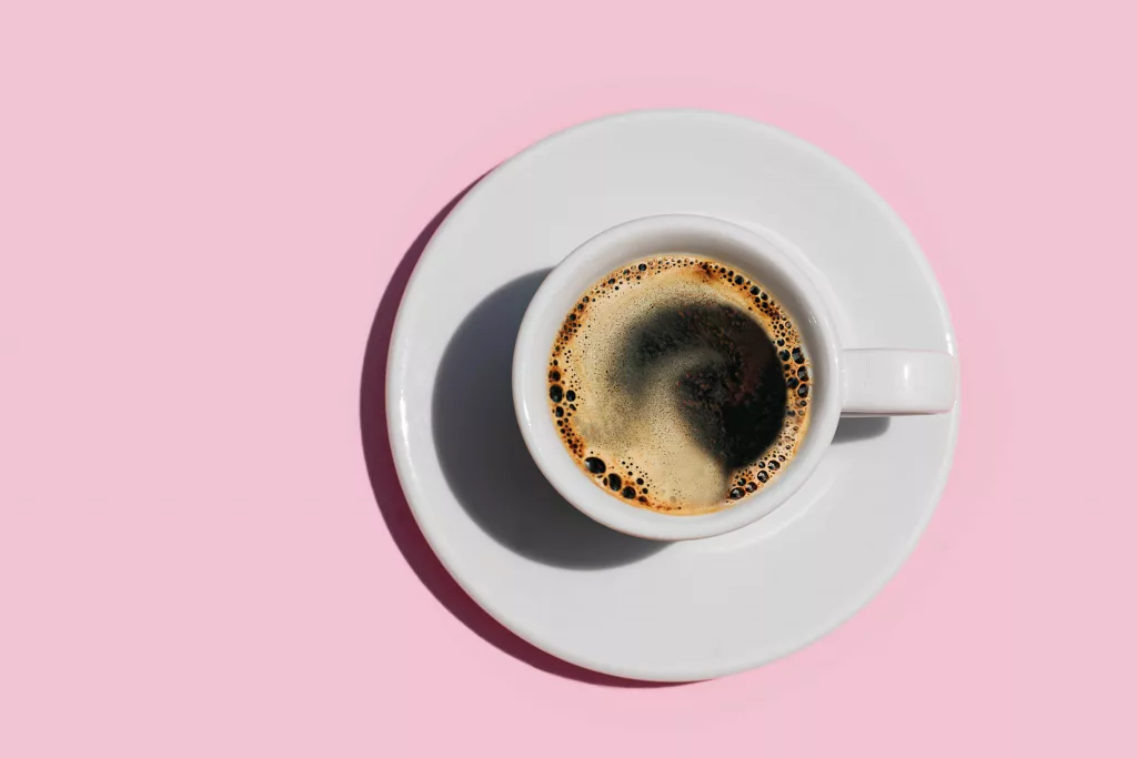 directly-above-shot-of-coffee-on-pink-color-royalty-free-image-1725899361151821